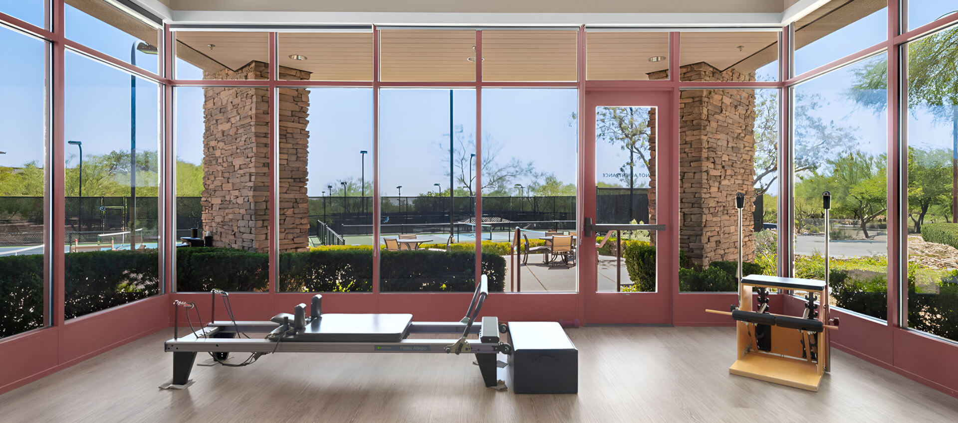 A gym area equipped with diverse exercise machines and fitness tools.